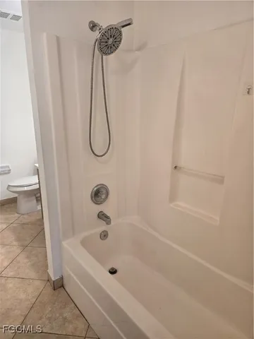 a bathroom with a bath tub and a shower
