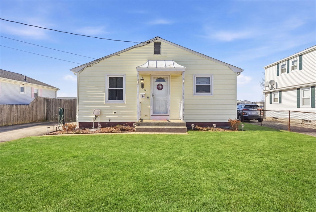 76 Lake Street Pawtucket, RI 02860 - Photo 1 of 18 a front view of a house with a garden