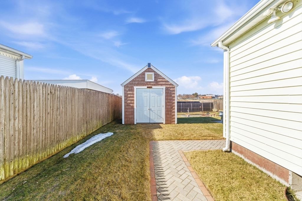 76 Lake Street Pawtucket, RI 02860 - Photo 17 of 18 a view of a big room with wooden floor and a yard