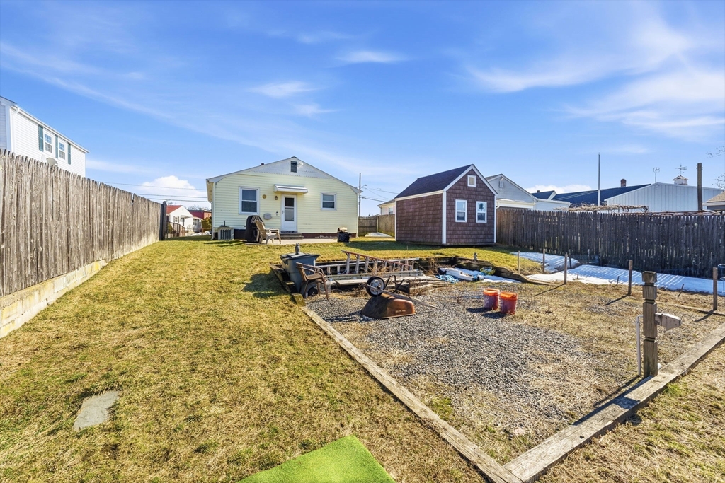 76 Lake Street Pawtucket, RI 02860 - Photo 18 of 18 a view of a house with swimming pool and a yard