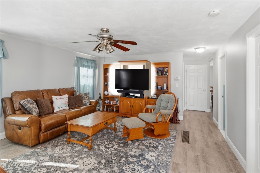 76 Lake Street Pawtucket, RI 02860 - Photo 2 of 18 a living room with furniture and a flat screen tv