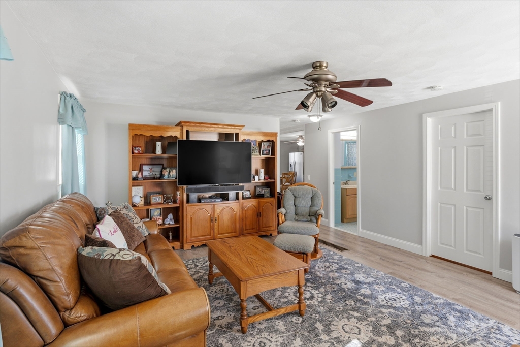 76 Lake Street Pawtucket, RI 02860 - Photo 3 of 18 a living room with furniture and a flat screen tv