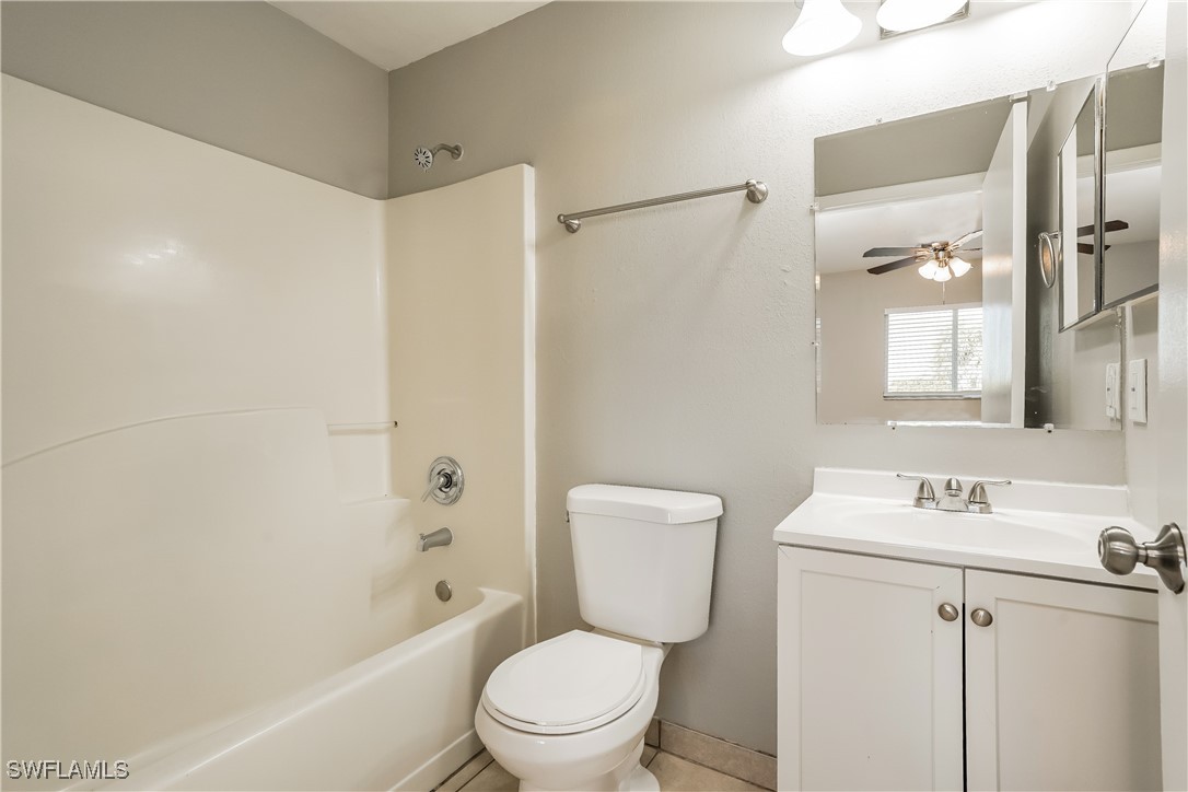 16981 First Street Alva, FL 33920 - Photo 14 of 16 a white toilet sitting next to a bath tub