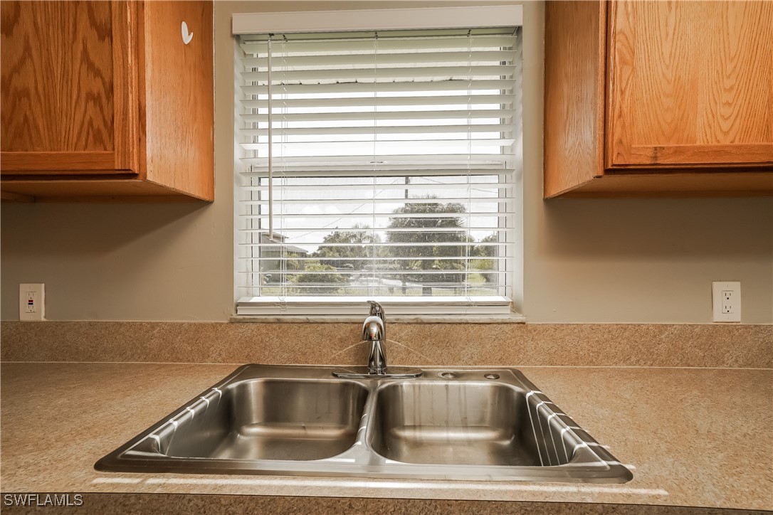 16981 First Street Alva, FL 33920 - Photo 6 of 16 a sink and dishwasher next to a window