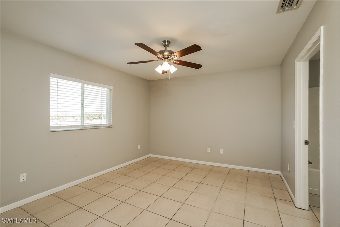 16981 First Street Alva, FL 33920 - Photo 9 of 16 a view of an empty room with a window