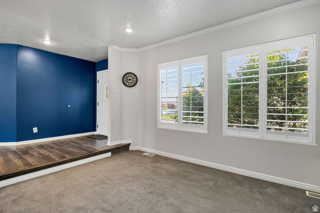 892 East 400 South Smithfield, UT 84335 - Photo 5 of 44 Unfurnished rront living room with baseboards and dark carpet
