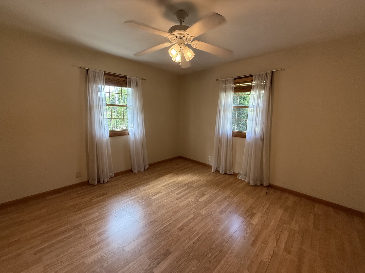 1029 West 4th Street Spring Valley, IL 61362 - Photo 15 of 27 an empty room with wooden floor and windows