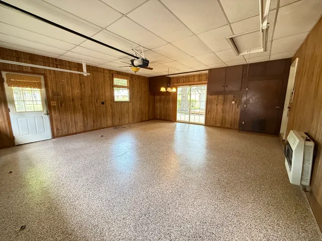 a view of a livingroom with wooden floor and windows