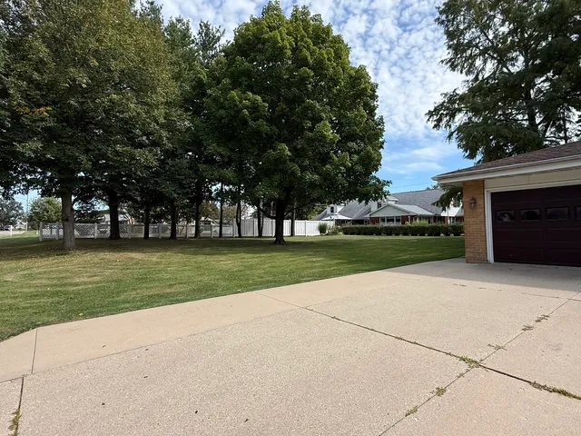 a view of a park with large trees