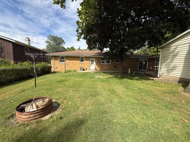 a house with swimming pool in front of it
