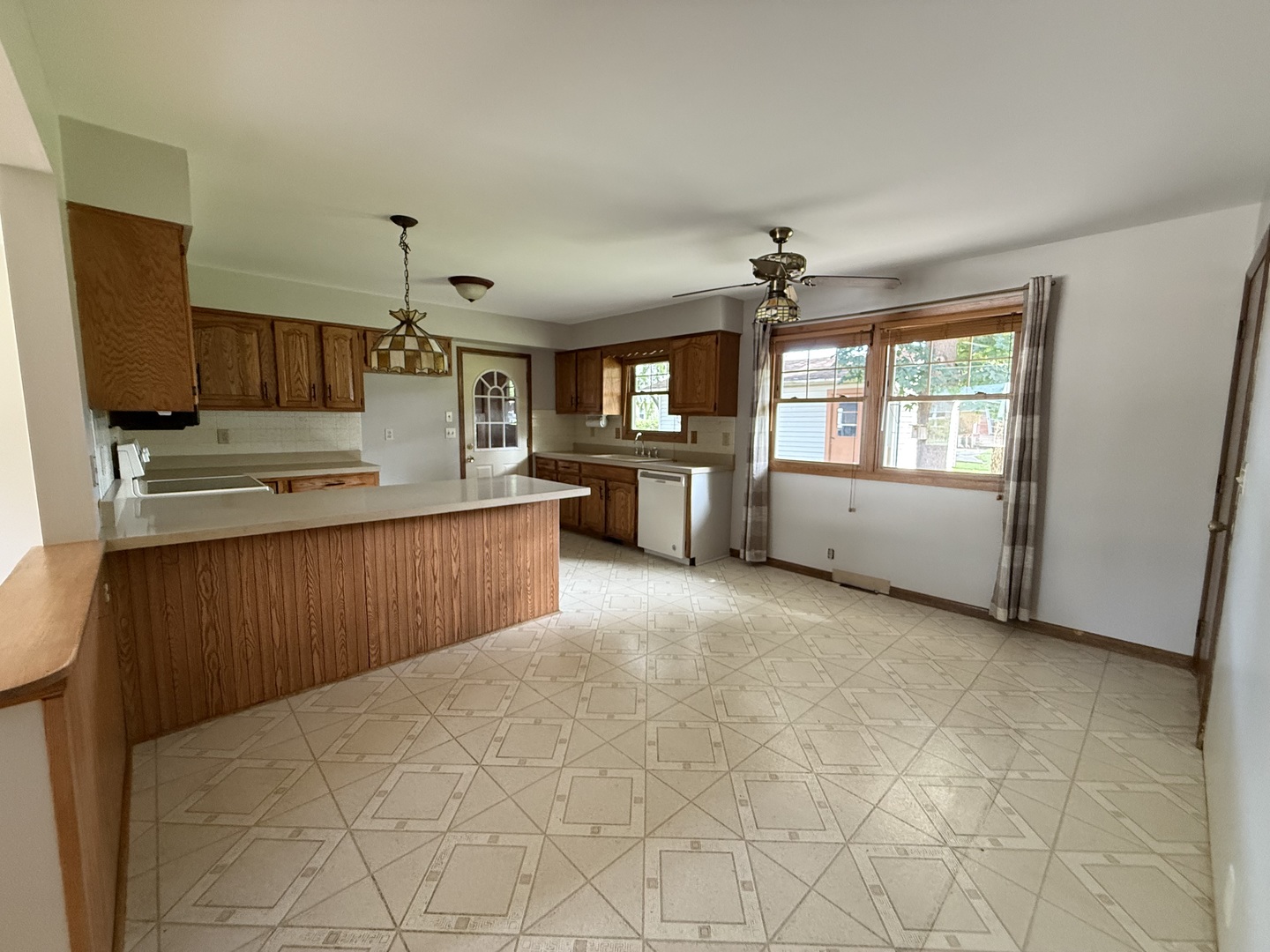 1029 West 4th Street Spring Valley, IL 61362 - Photo 10 of 27 a kitchen with stainless steel appliances granite countertop a stove sink and cabinets