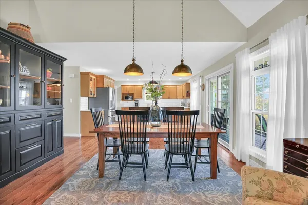 a kitchen with a stove a refrigerator and wooden cabinets