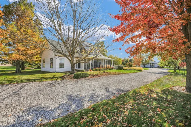a view of yard with swimming pool and green space