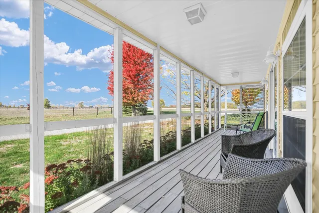 a front view of a house with a yard and a garage