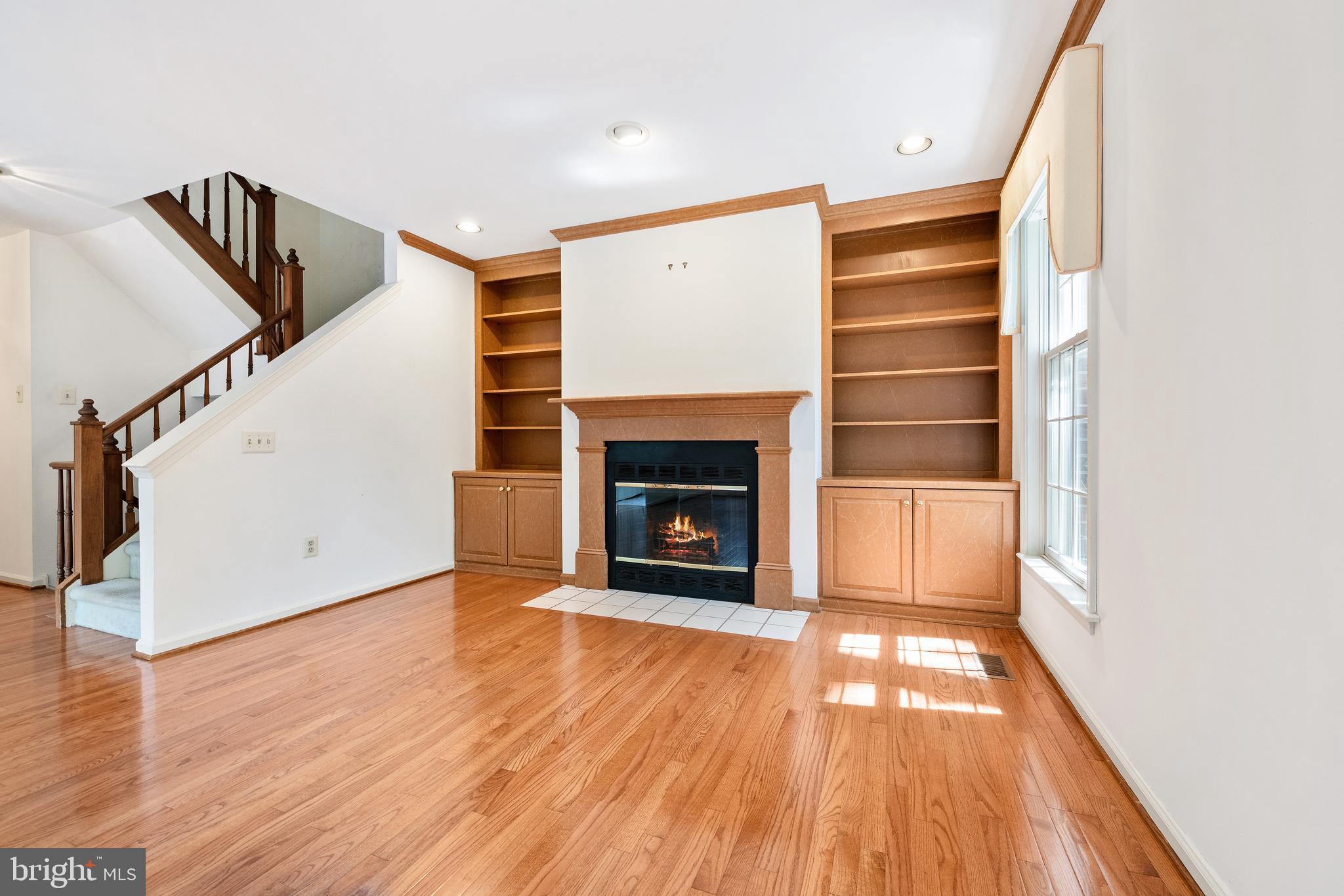 105 Brighton Road Devon, PA 19333 - Photo 5 of 22 LR Fireplace and Built-In Shelves