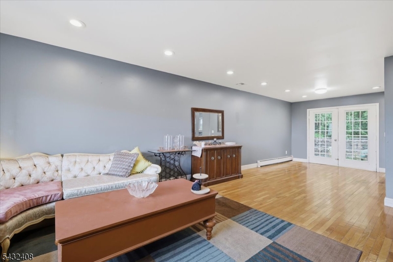 112 Knob Hill Road Hackettstown, NJ 07840 - Photo 6 of 32 a living room with furniture and a flat screen tv