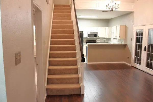 a view of a kitchen from the hallway