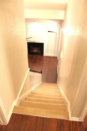 a bedroom with a bed and a mirror