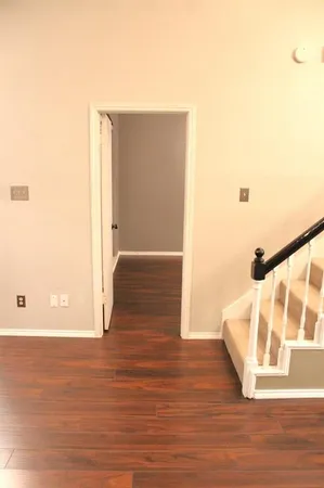 a view of an entryway with wooden floor