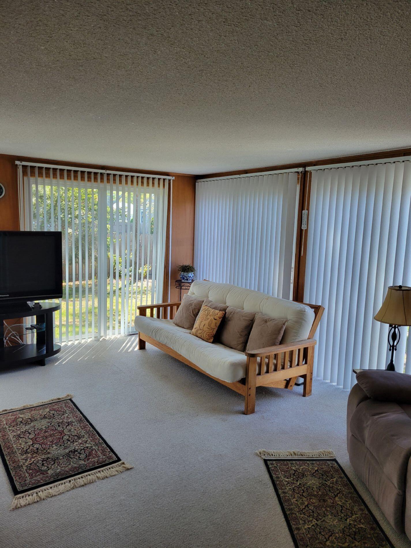 115 Captain Chase Road South Yarmouth, MA 02664 - Photo 20 of 36 a living room with furniture and a flat screen tv
