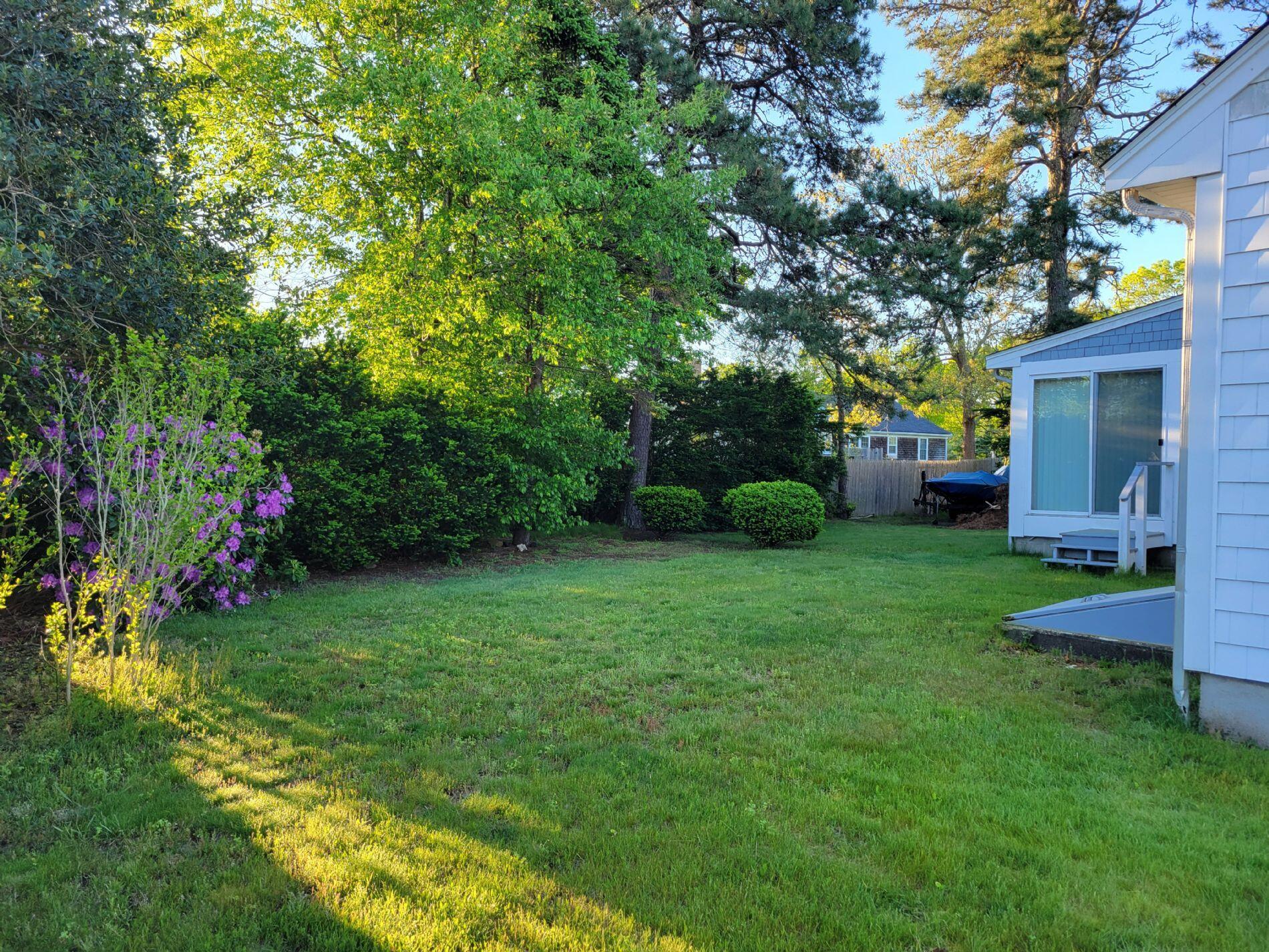115 Captain Chase Road South Yarmouth, MA 02664 - Photo 2 of 36 a view of a house with backyard and a tree