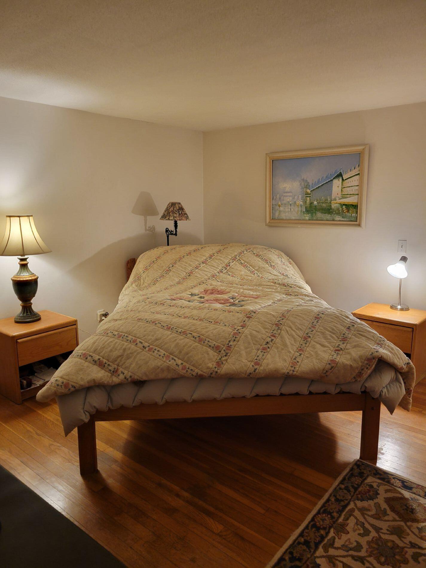 115 Captain Chase Road South Yarmouth, MA 02664 - Photo 21 of 36 a bedroom with a bed and lamp with table