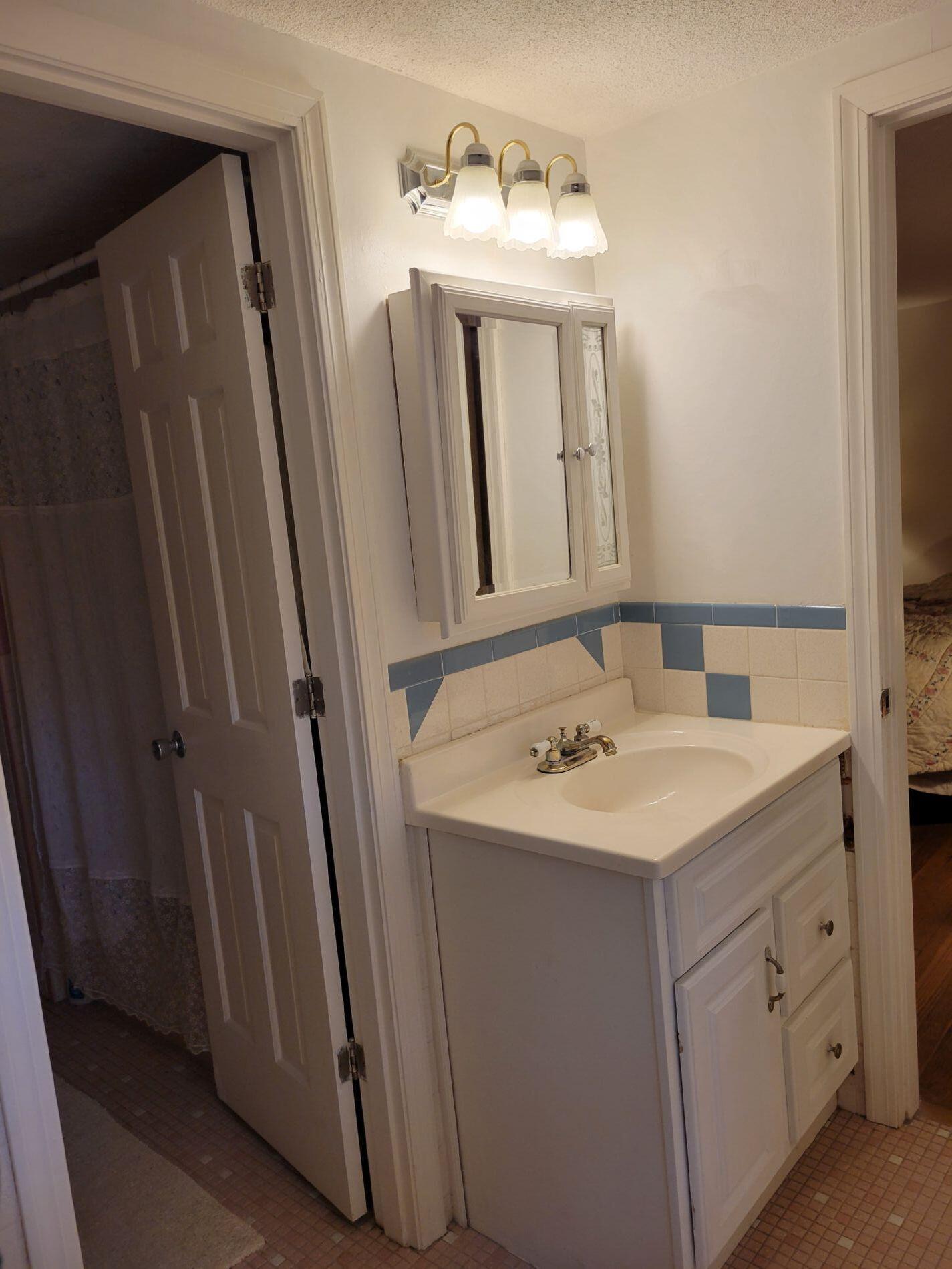 115 Captain Chase Road South Yarmouth, MA 02664 - Photo 28 of 36 a bathroom with a sink and a mirror