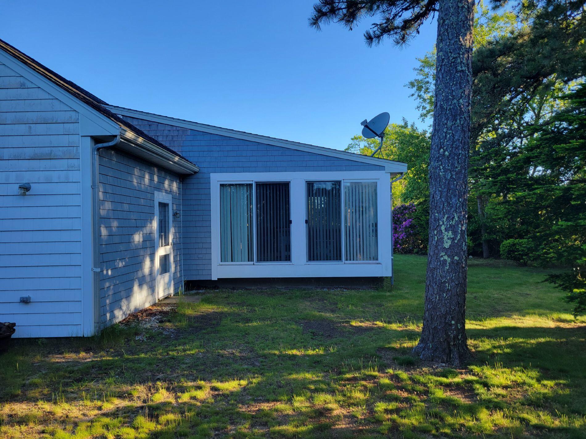 115 Captain Chase Road South Yarmouth, MA 02664 - Photo 4 of 36 a view of a house with backyard and garden