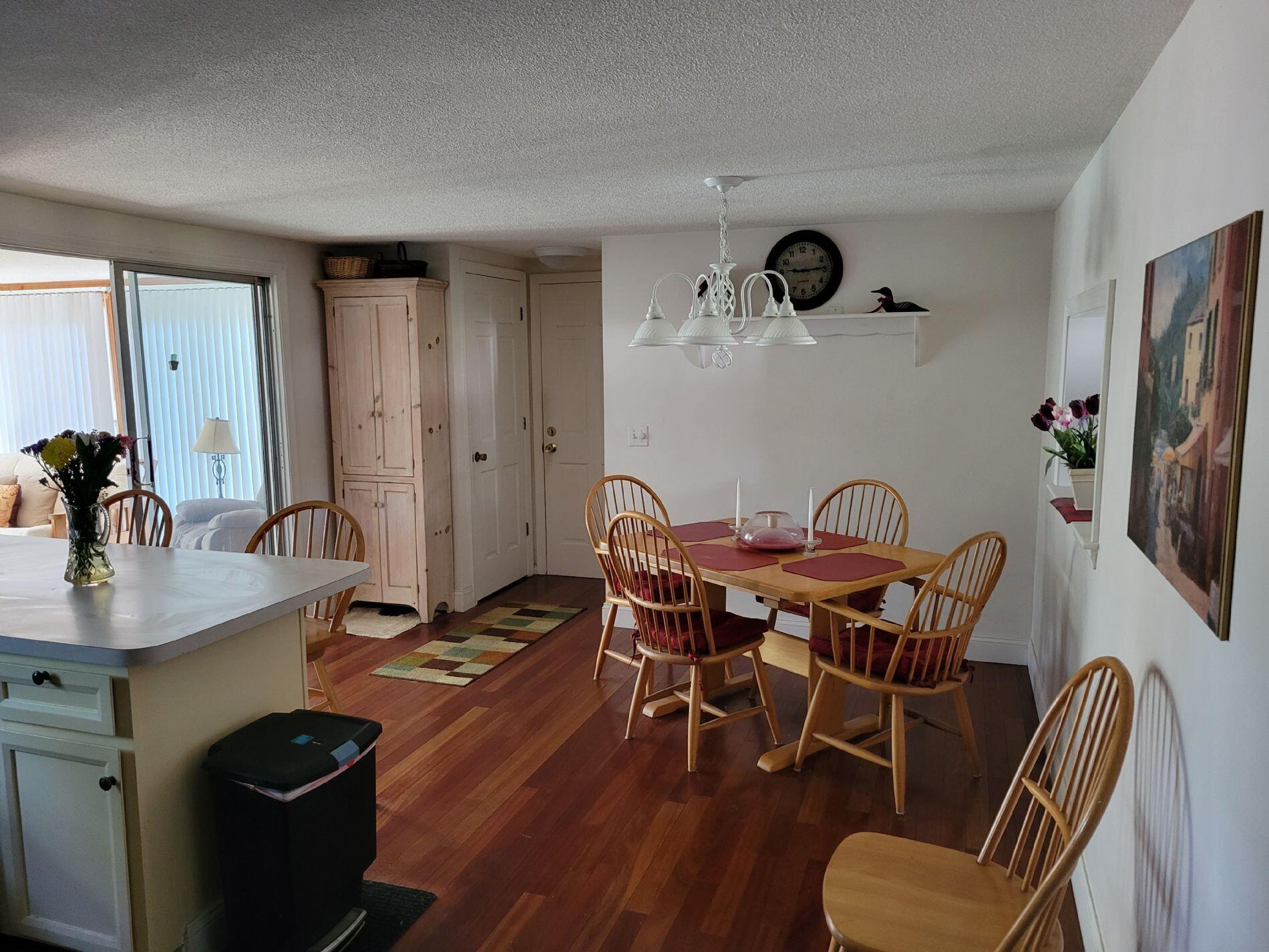 115 Captain Chase Road South Yarmouth, MA 02664 - Photo 10 of 36 a view of a dining room with furniture and wooden floor