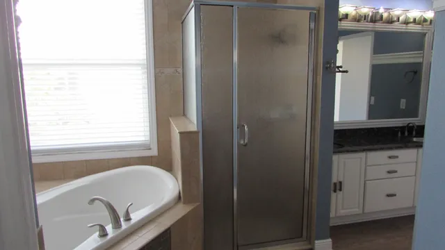 a bathroom with a tub and a sink