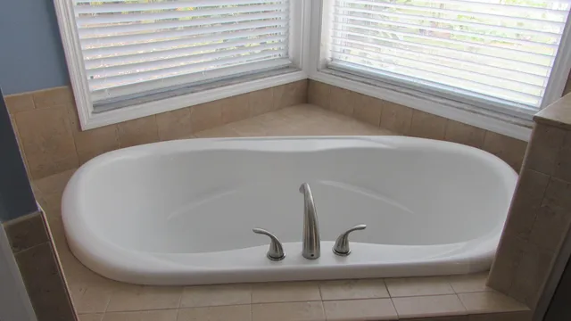 a white bath tub sitting in a bathroom
