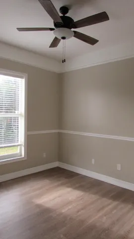 an empty room with a empty space and a window