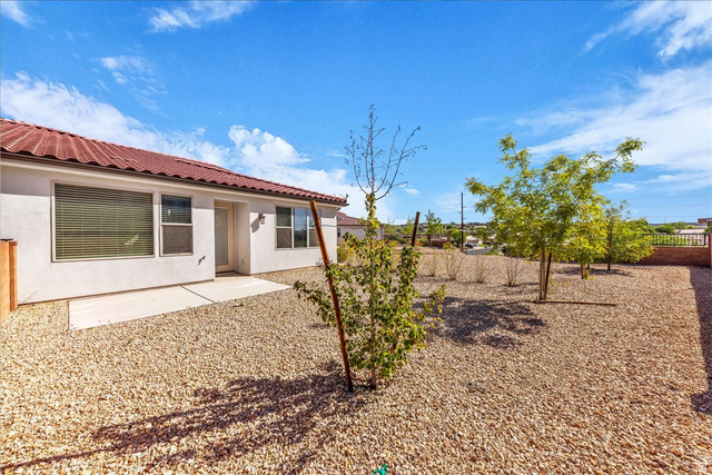 794 North Via Modelo Circle Washington, UT 84780 - Photo 5 of 21 Back of house featuring a patio area, stucco siding, a fenced backyard, and a tile roof