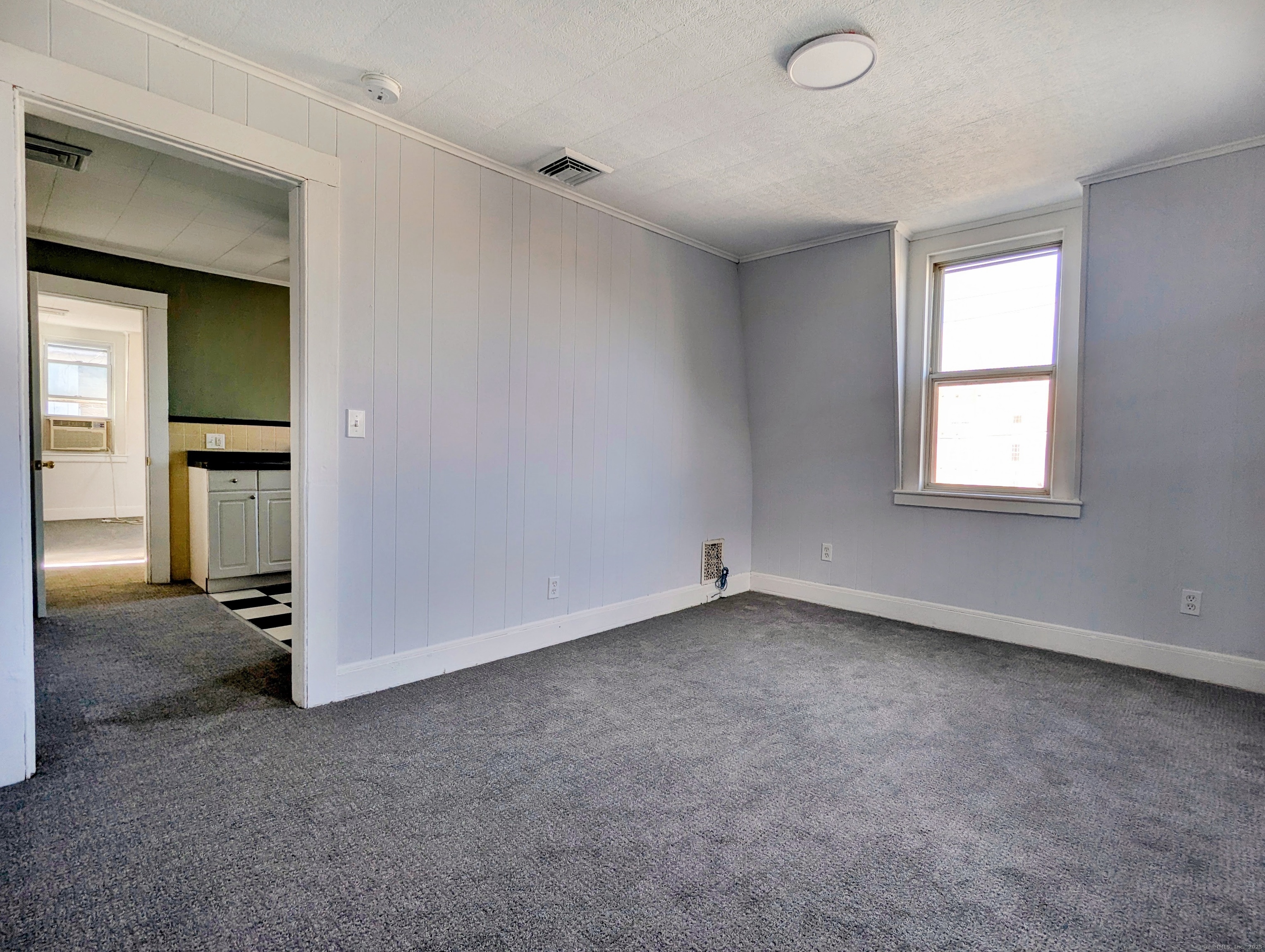 45 White Street Shelton, CT 06484 - Photo 4 of 10 an empty room with windows and closet