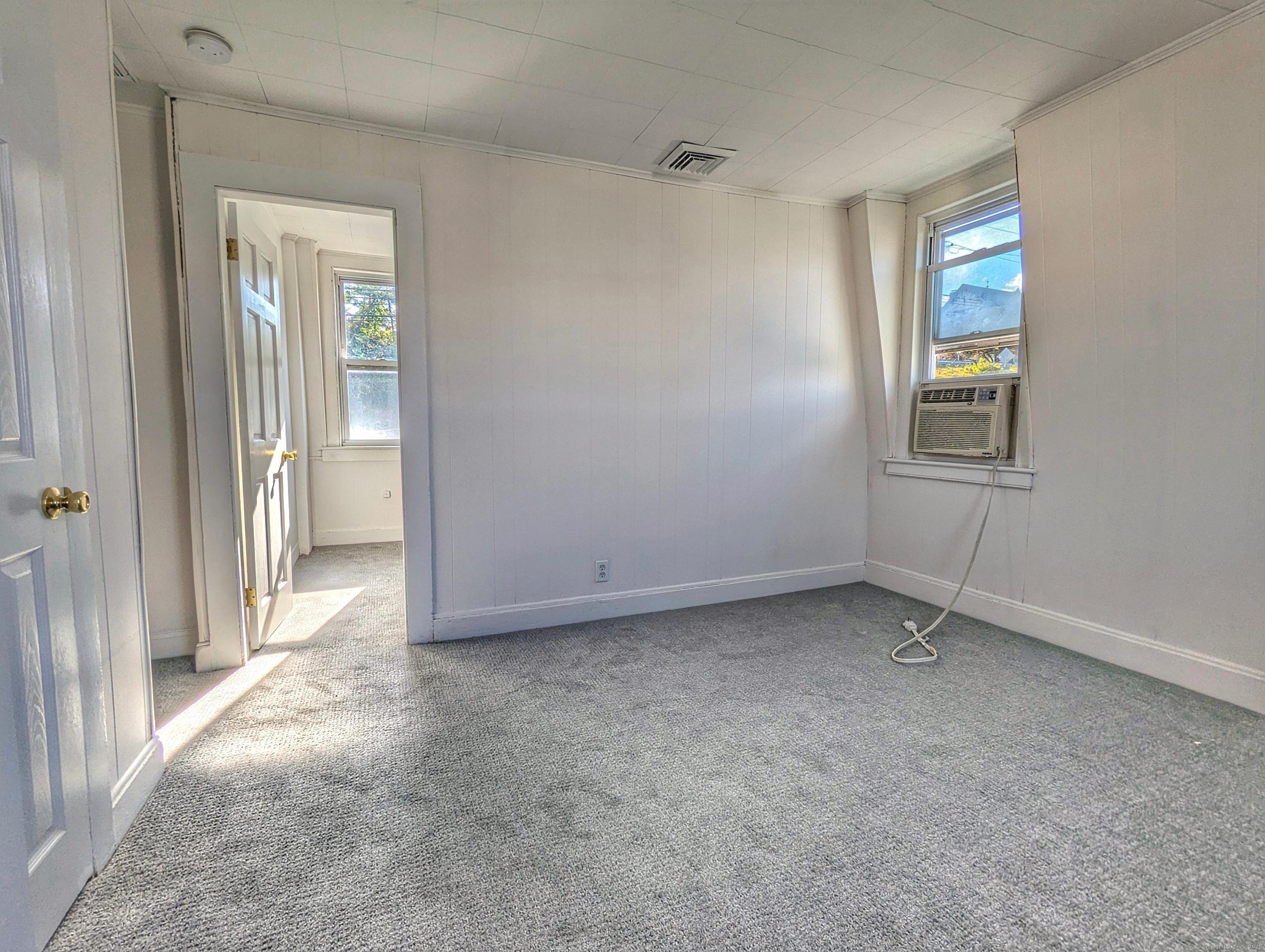 45 White Street Shelton, CT 06484 - Photo 6 of 10 an empty room that has a window in it