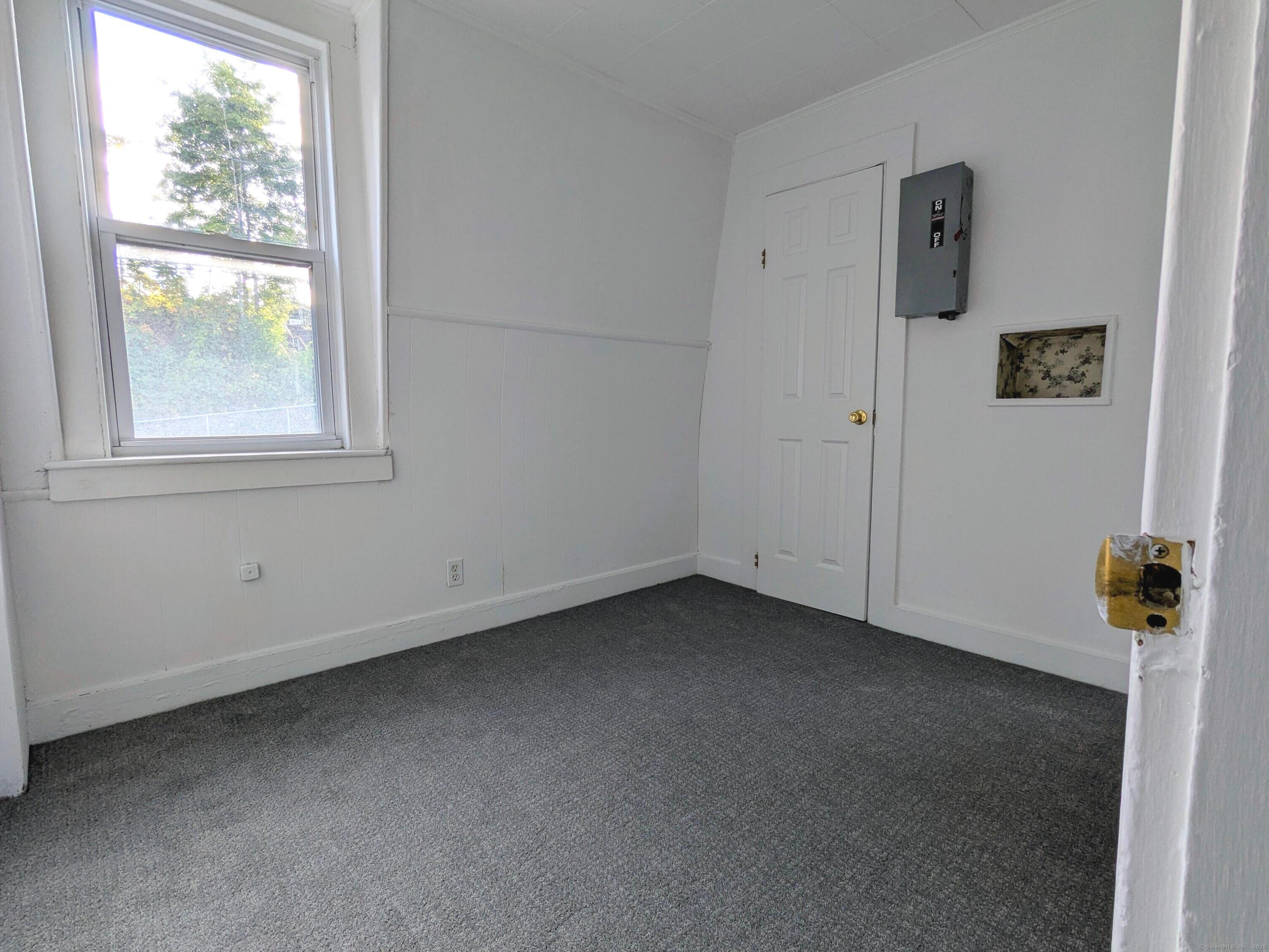 45 White Street Shelton, CT 06484 - Photo 7 of 10 an empty room with a window