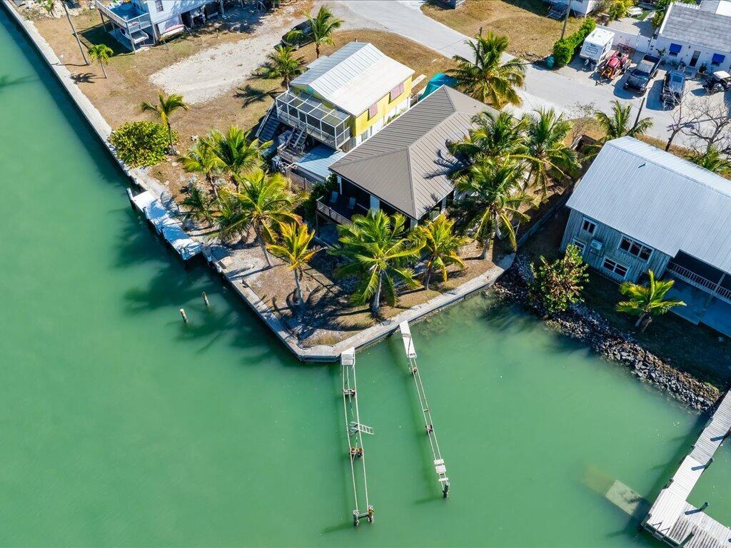 232 Harbor Place North Goodland, FL 34140 - Photo 17 of 24 a view of a lake with a yard