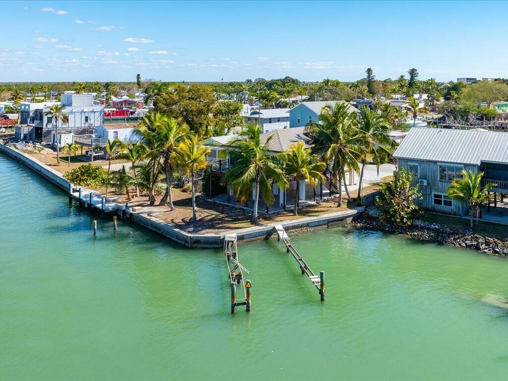 232 Harbor Place North Goodland, FL 34140 - Photo 18 of 24 a view of a lake with houses