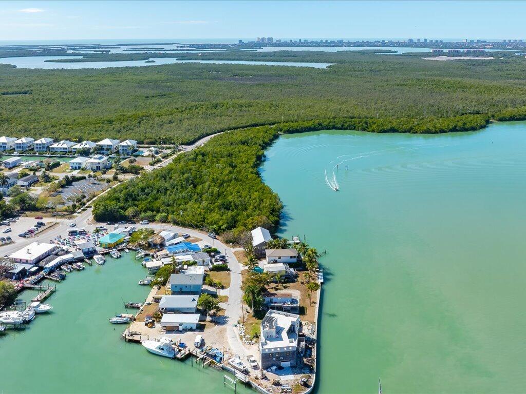 232 Harbor Place North Goodland, FL 34140 - Photo 22 of 24 a view of a lake with a houses