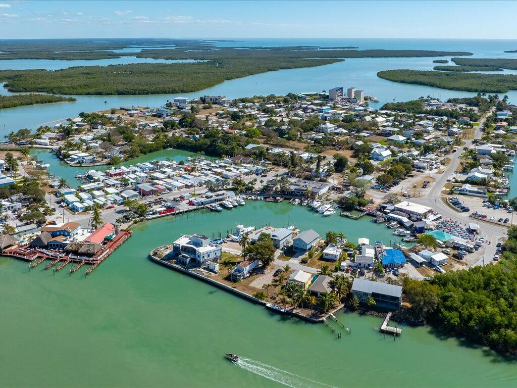 232 Harbor Place North Goodland, FL 34140 - Photo 23 of 24 a view of a lake with a car parked