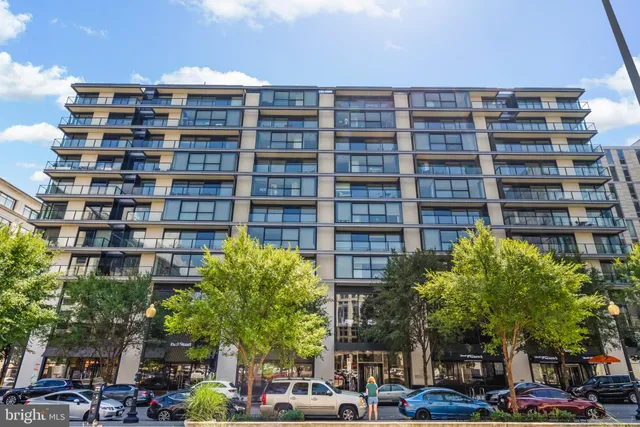 a living room filled with furniture window and wooden floor