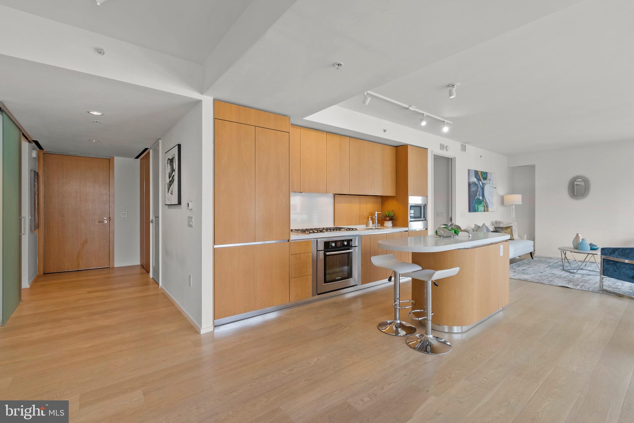 920 I Street Northwest, Unit 1009 Washington, DC 20001 - Photo 16 of 75 a view of a kitchen with furniture and a window