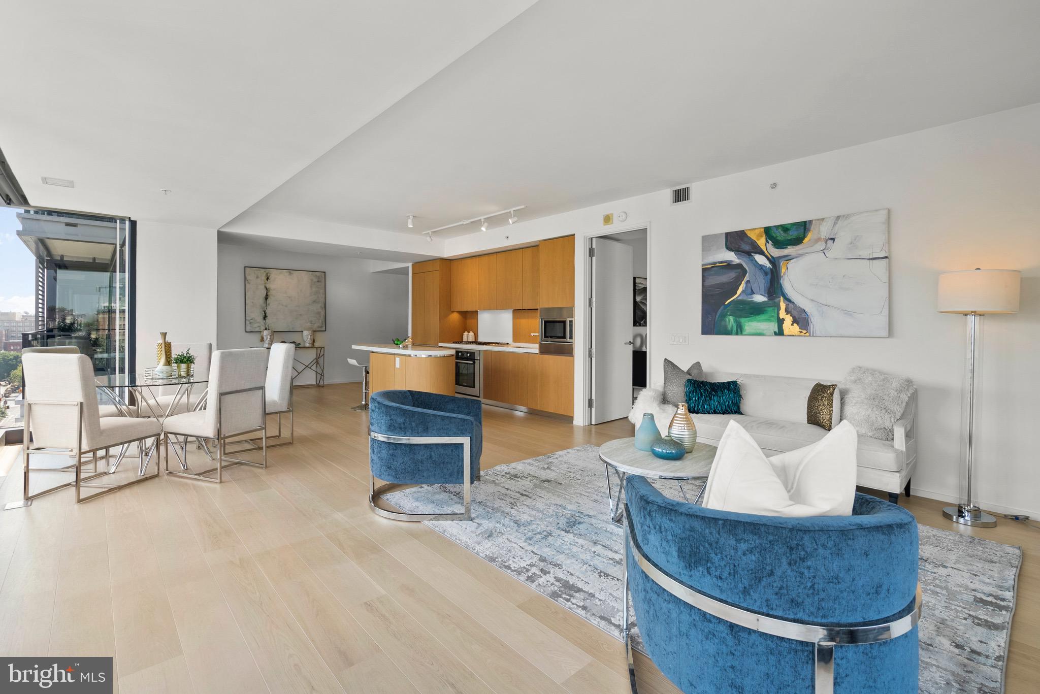 920 I Street Northwest, Unit 1009 Washington, DC 20001 - Photo 23 of 75 a living room with furniture and a kitchen