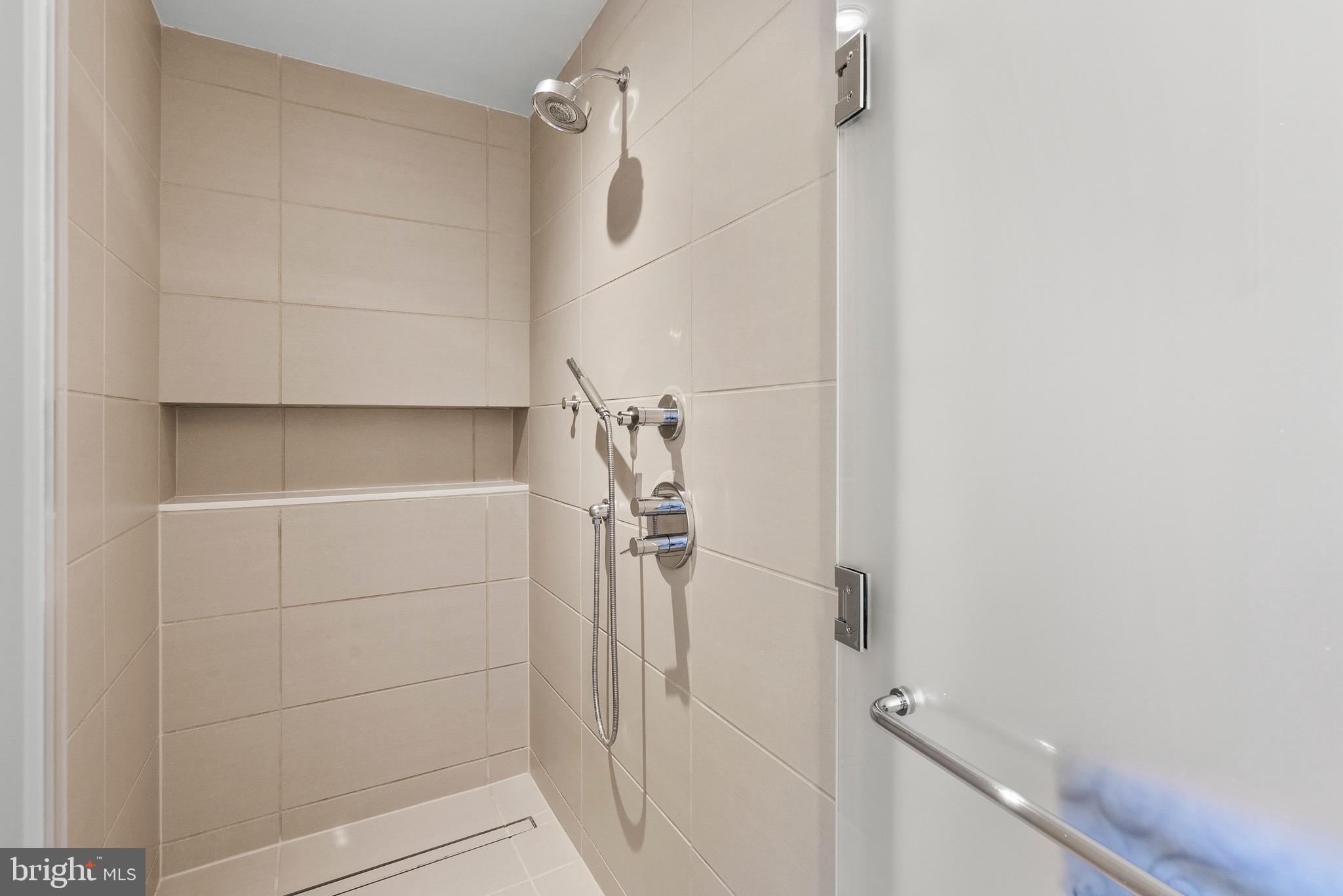 920 I Street Northwest, Unit 1009 Washington, DC 20001 - Photo 30 of 75 a bathroom with a shower