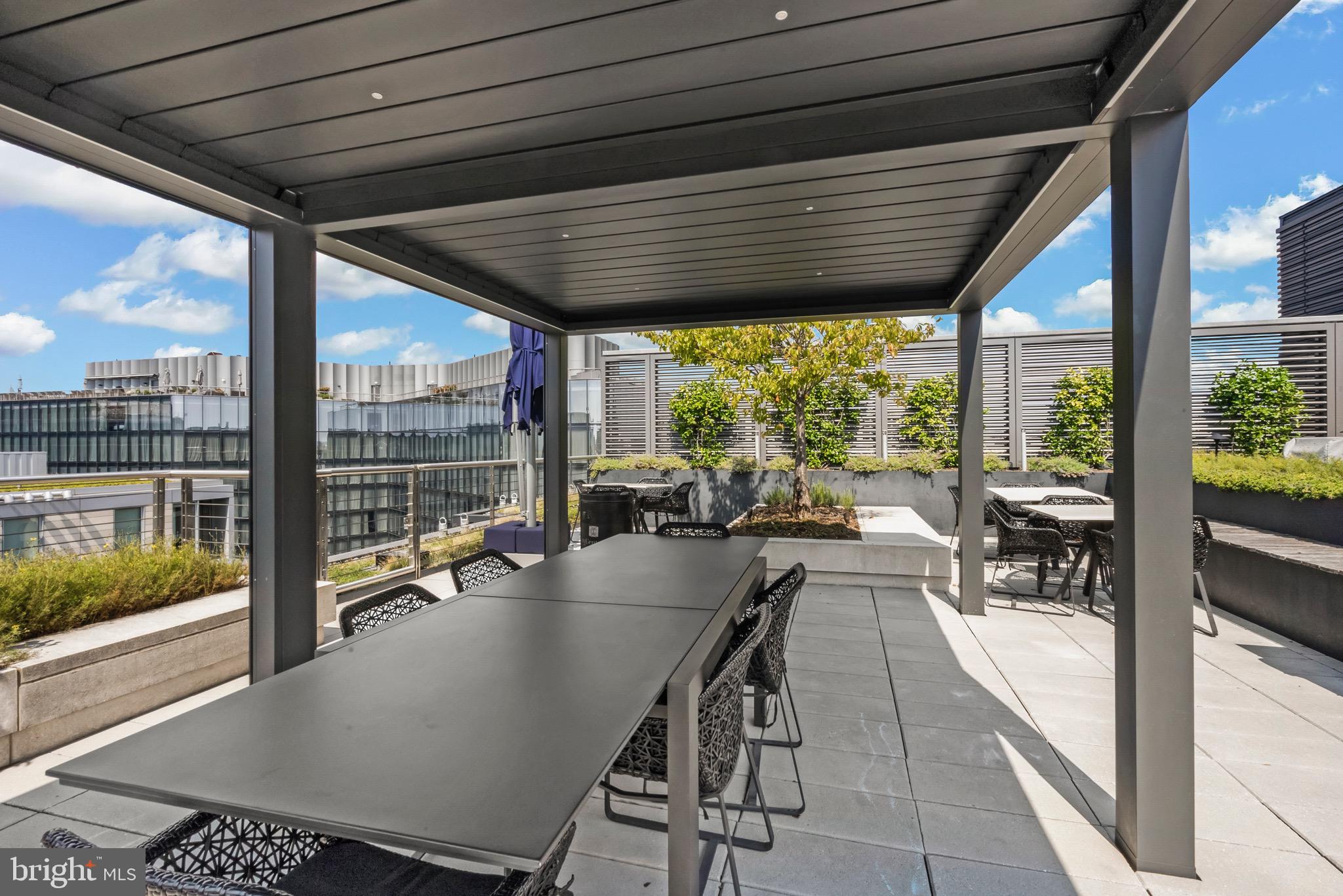 920 I Street Northwest, Unit 1009 Washington, DC 20001 - Photo 42 of 75 a dining room with furniture water view and a floor to ceiling window