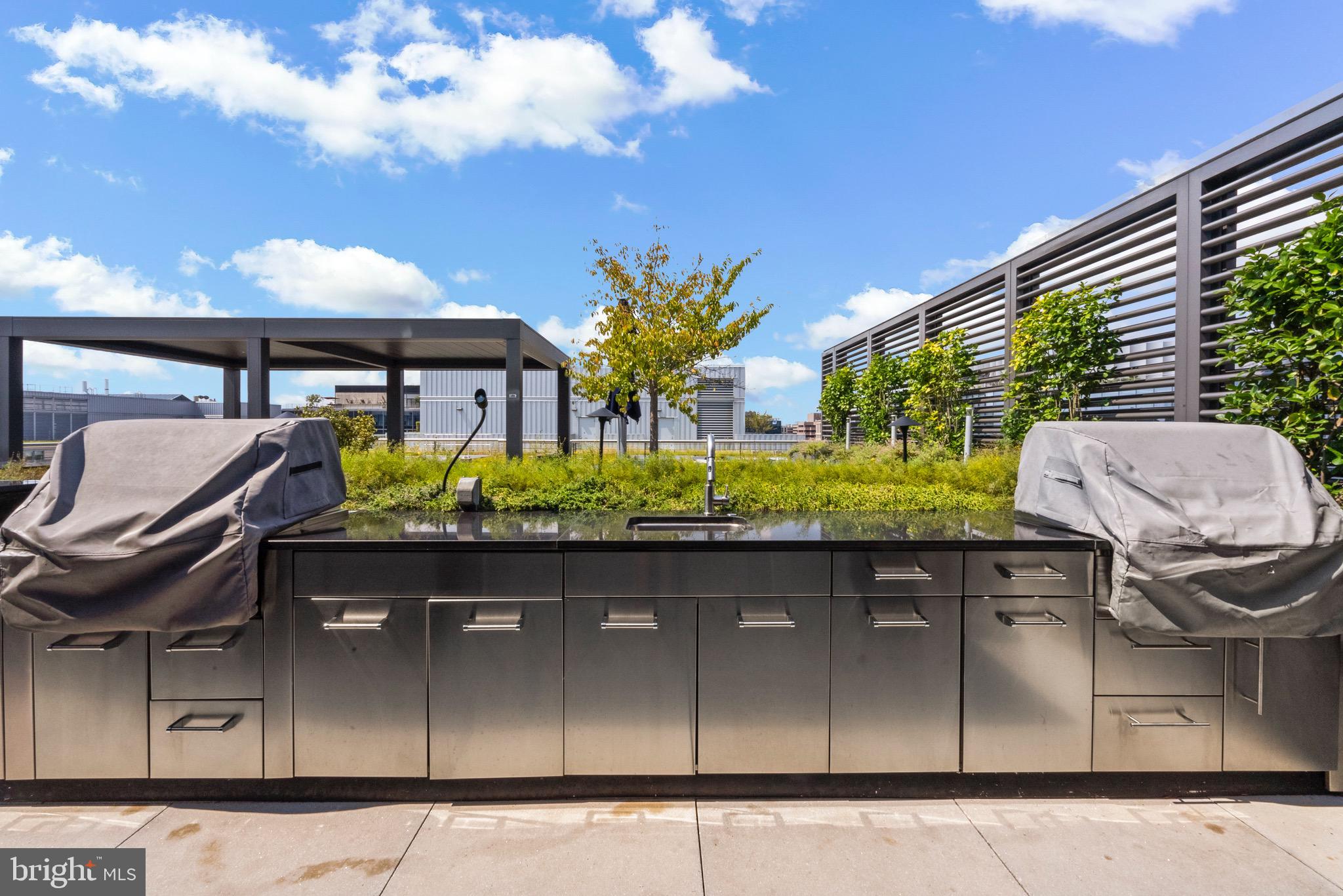 920 I Street Northwest, Unit 1009 Washington, DC 20001 - Photo 43 of 75 a view of a chair and tables in the patio