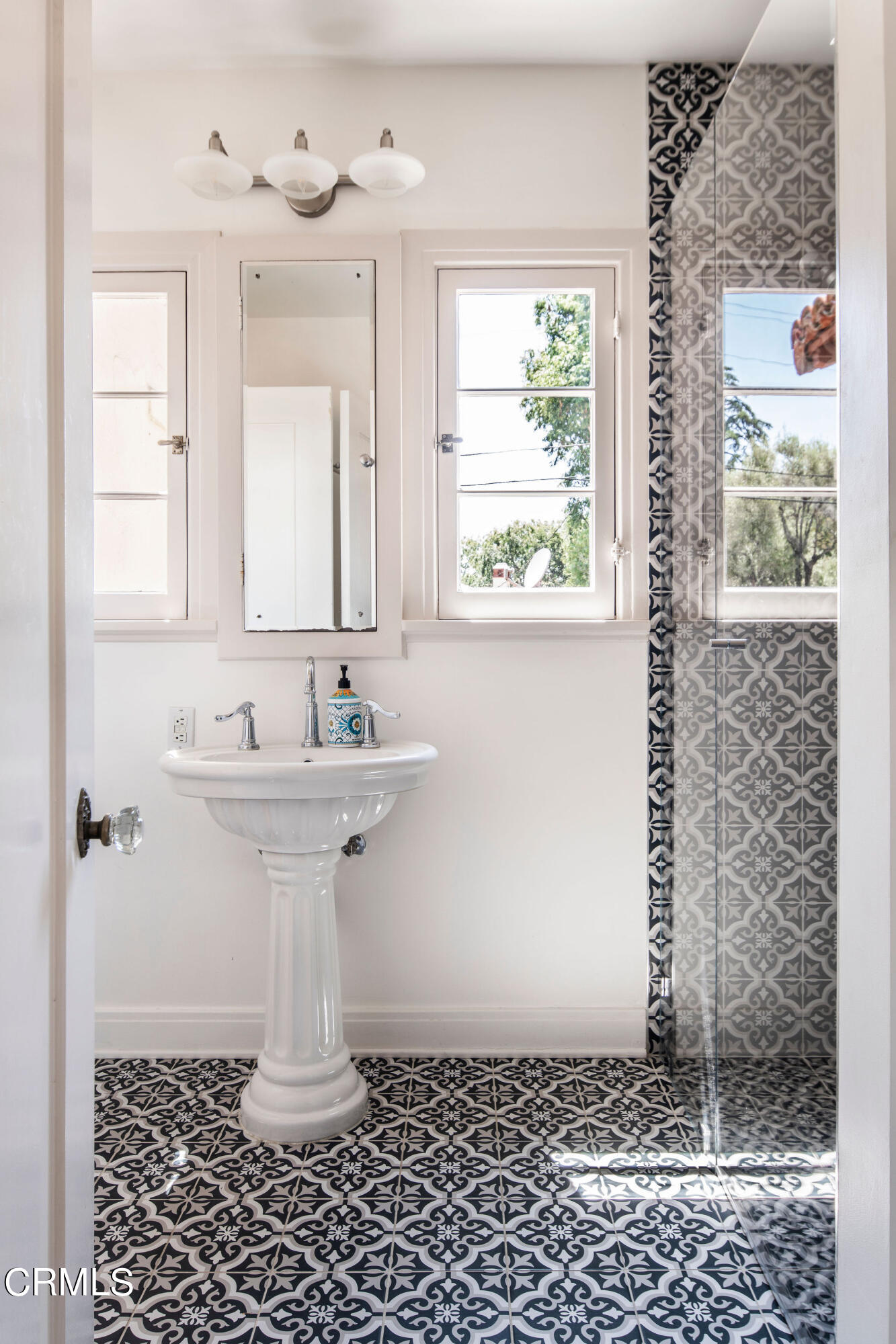 1211 Cortez Drive Glendale, CA 91207 - Photo 31 of 51 a bathroom with a sink a window and shower
