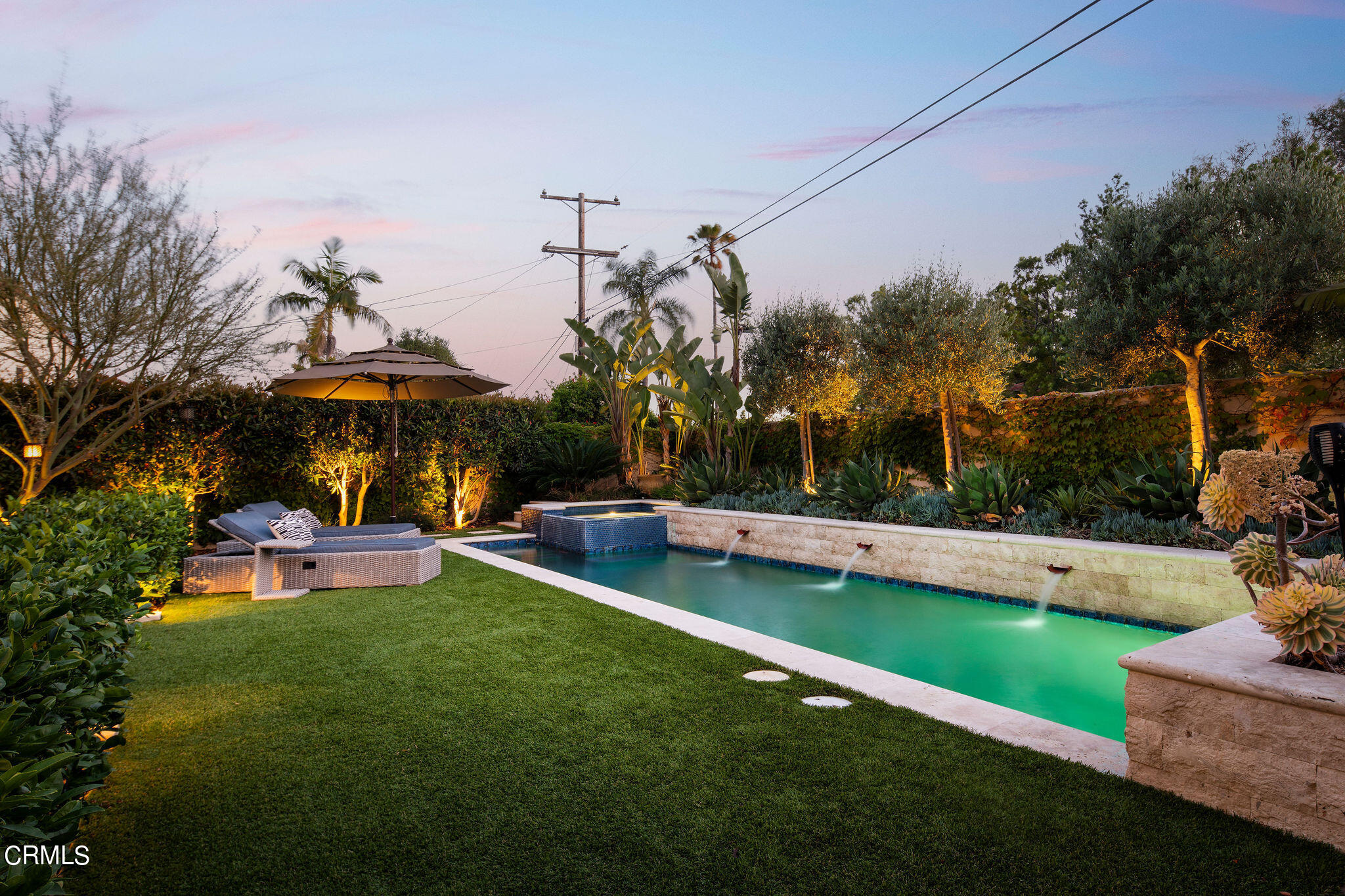 1211 Cortez Drive Glendale, CA 91207 - Photo 49 of 51 a view of a swimming pool and lounge chairs in back yard of the house