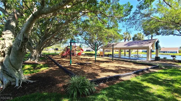 a view of outdoor space with garden and trees