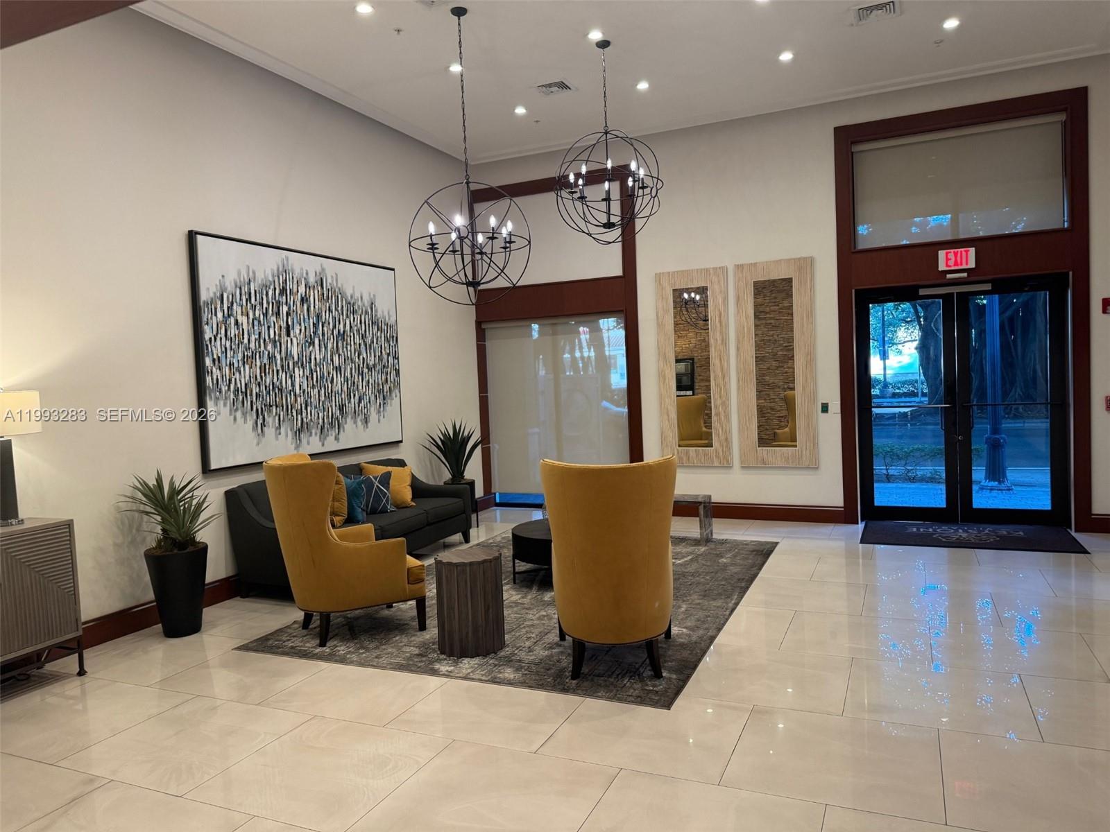 3530 Southwest 22nd Street, Unit 706 Miami, FL 33145 - Photo 12 of 18 a living room with furniture a large window and a fireplace